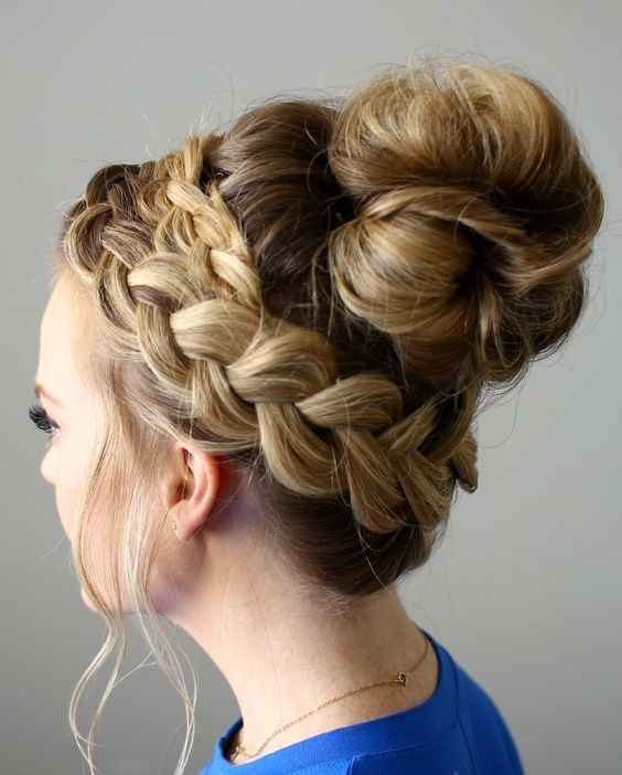 a chic twisted top knot, a braid for detailing and a fringe for a polished and very stylish look