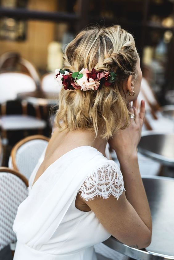 wavy and braided half updo with a bump is a stylish and chic idea for a wedding