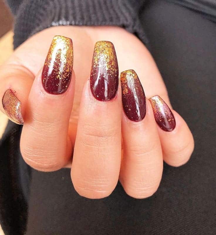 maroon and gold ombre nails