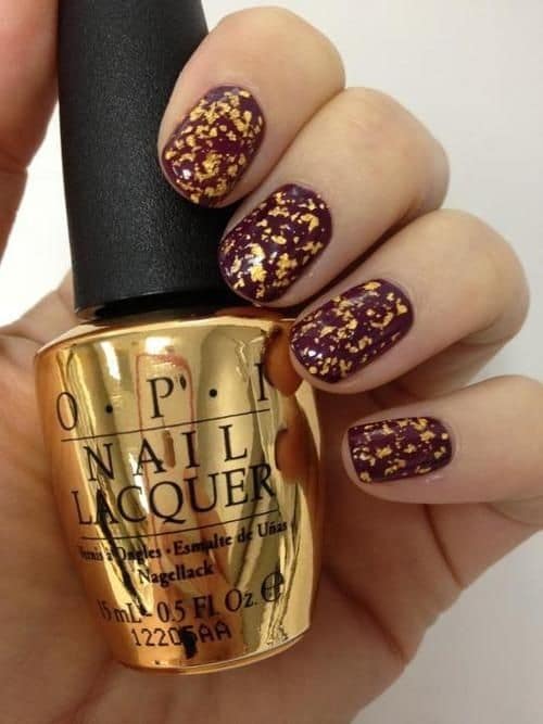 OPI Maroon and gold nails