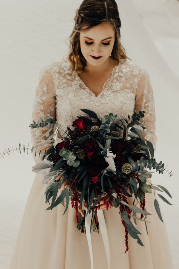a very dark burgundy bridal lip is exactly what you need to make your winter wedding look a bit decadent and refined