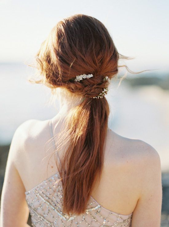 a chic bubble ponytail plus a lush floral crown for a moody bride to stand out