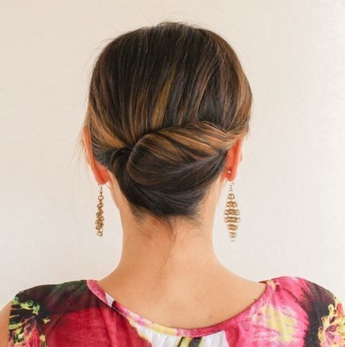 one more catchy idea of a messy chignon and twists and locks down and a small rhinestone hairpiece