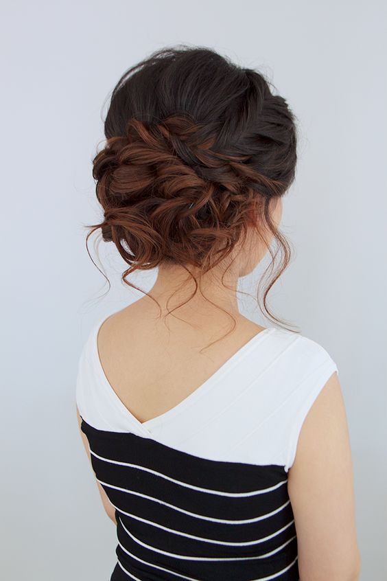 twisted braided updo with a cool texture and a small hairpiece on the side