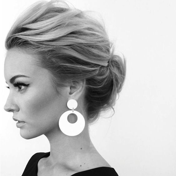 a top knot accessorized with a velvet bow is a classic idea to try