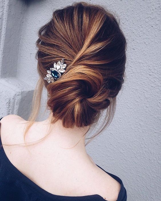 a twisted large low bun is a very chic option, which will easily fit a more formal look