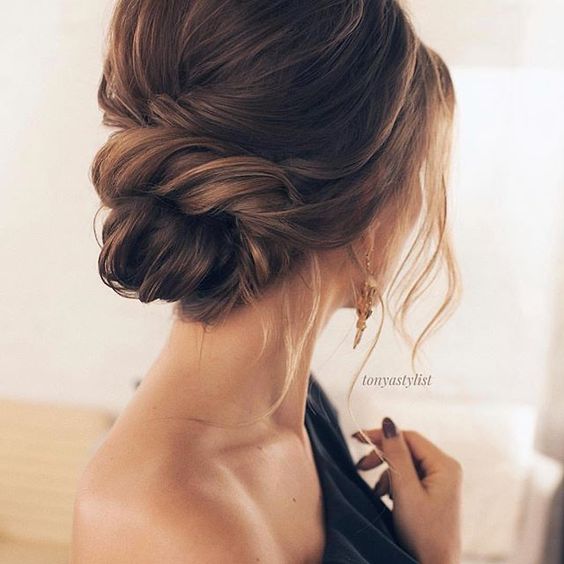 a Dutch braid ponytail with waves and a bump is a cool and feminine idea for a hairstyle