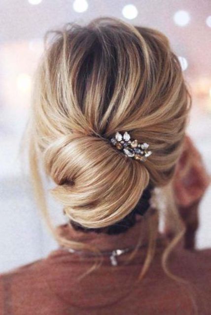 a messy twisted updo with pearl pins is a delicate idea for a romantic girl