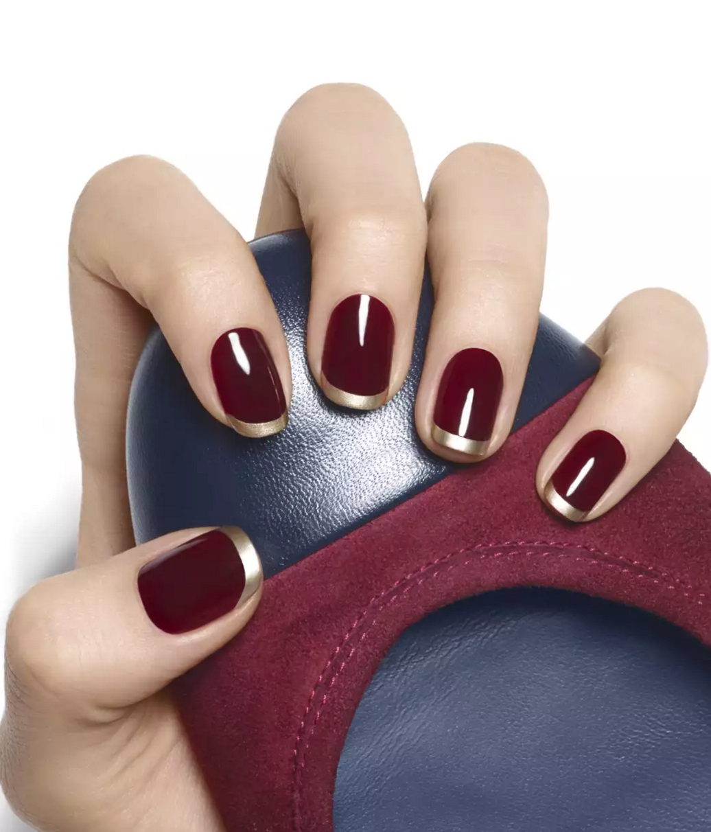 Gilt tip red manicure