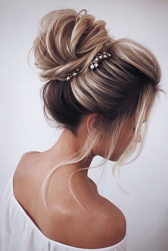 a large ballerina bun is classics, which is ideal for a formal wedding in any venue
