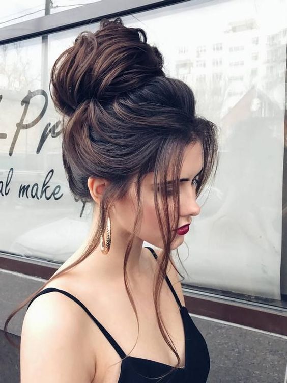 an upside down French braid with a top knot is a creative and whimsy option for top knot fans
