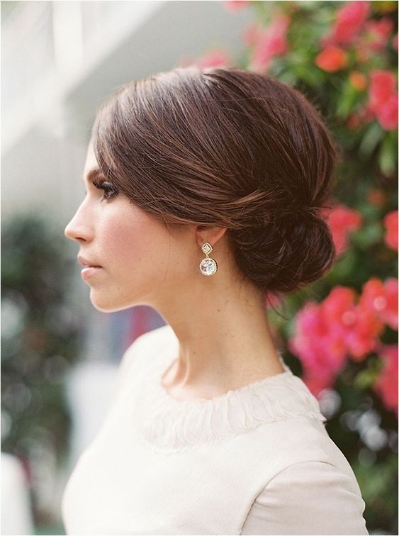a casual messy ponytail with a bum and twists is amazing for an elegant modern bride, it may also fit a boho look