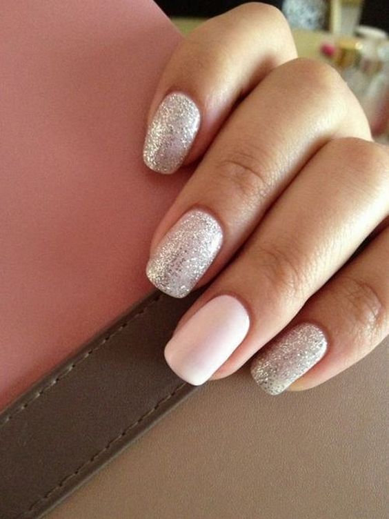 a nude manicure with a touch of glitter and silver nails for those who still insist on classics