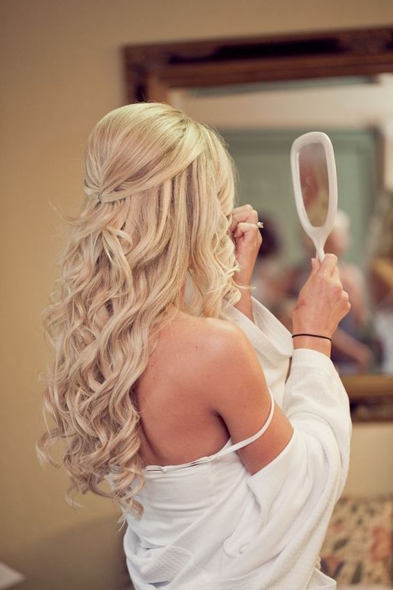 a romantic wavy half updo accessorized with a gold hair vine looks wow