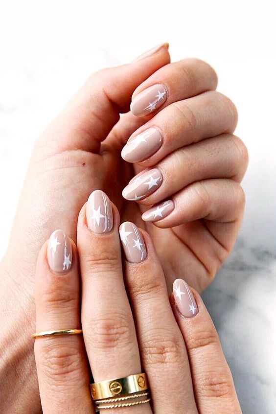 blush nails with a tiny quote on the ring finger - choose your favorite quote about love and relationships