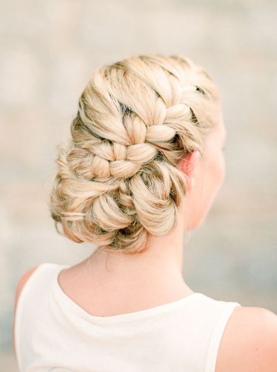 elegant twisted low bun with a sparkling flower hairpiece
