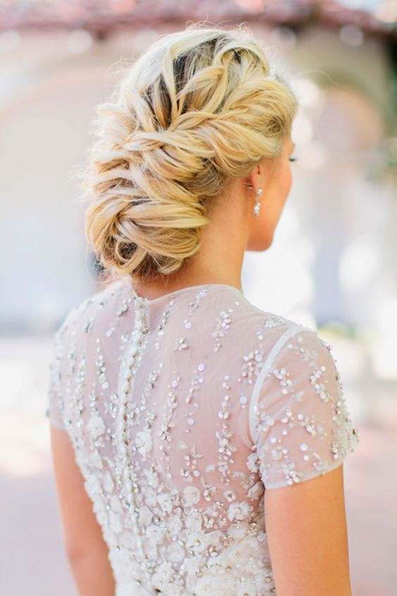 twisted low bun with a rhinestone hairpiece on one side