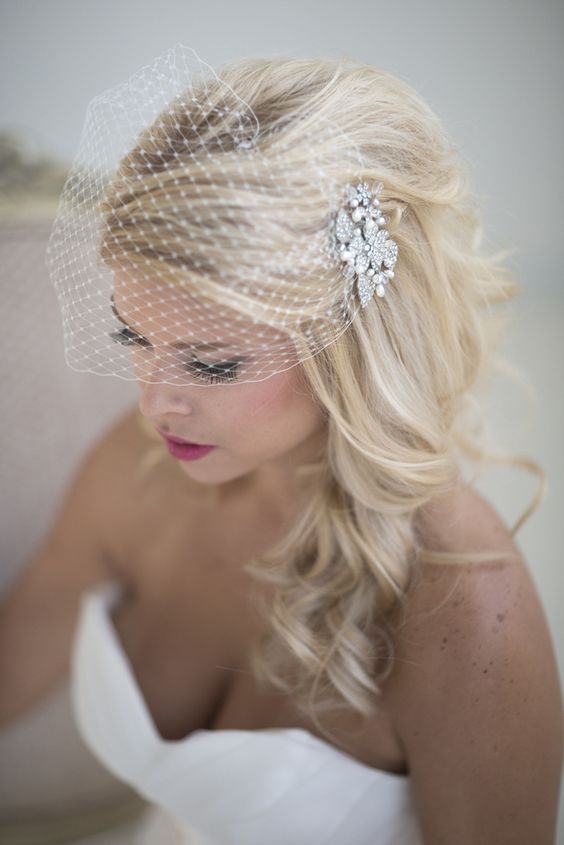 delicate pearl birdcage veil with a side updo