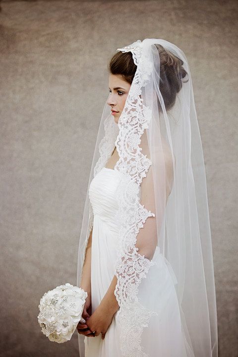 half updo with a mantilla veil for a heavenly look