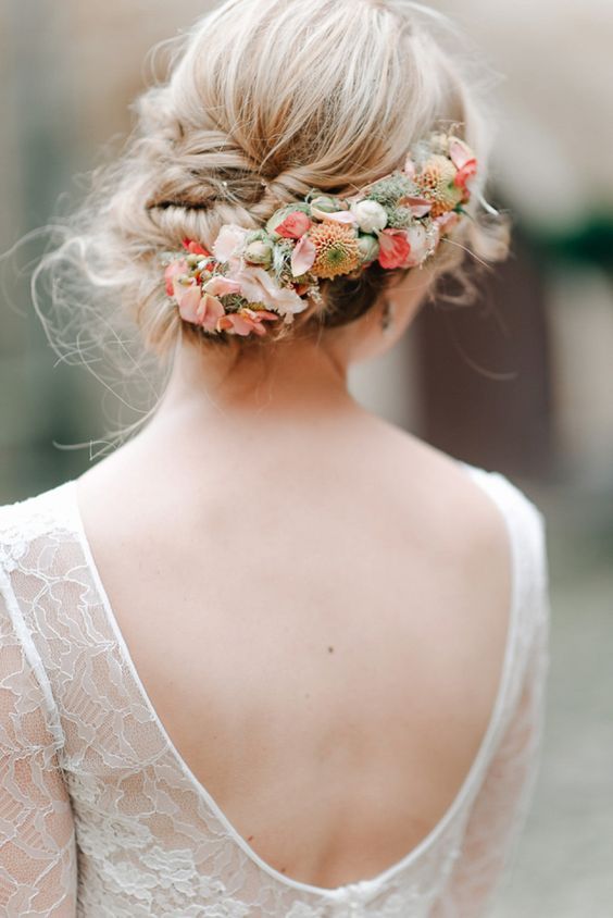 curly updo with fresh blooms and greenery