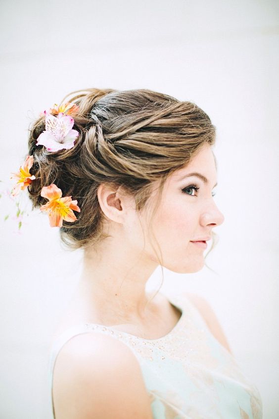large fresh blooms for a twisted wedding updo
