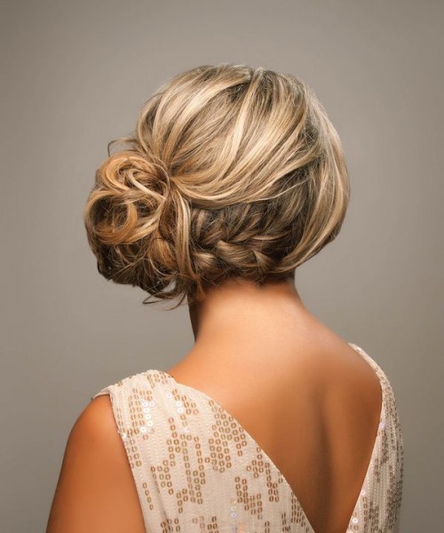 a curly twsited and wavy side updo with a volume on top for long hair and a romantic vintage bridal look
