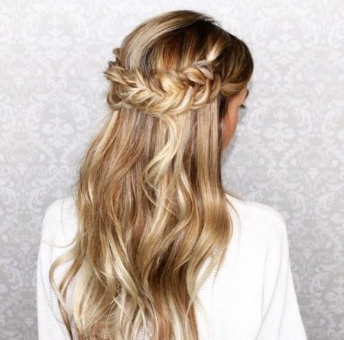 a sleek twisted low updo is a chic idea with a retro touch that will fit medium length hair