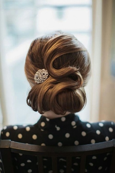a vintage wedding updo with fixed curls on one side is a cool statement that will help you pull off the look