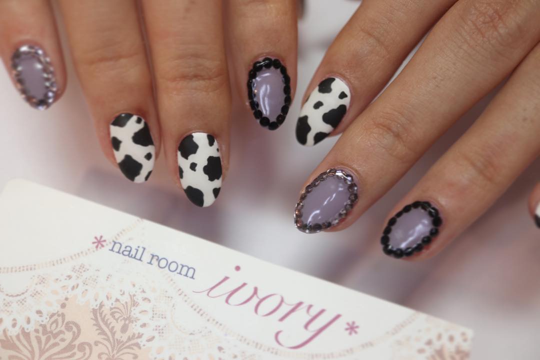 Purple Nail Art with Cow Design