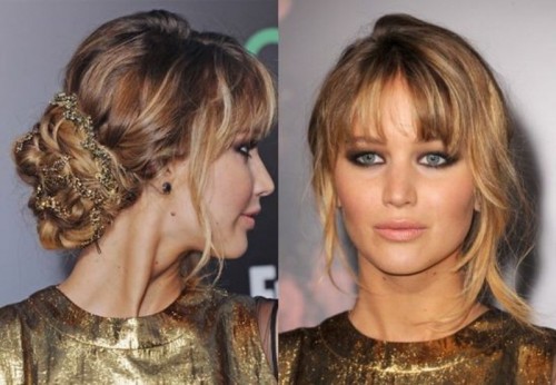 a long wavy half updo with bangs is a romantic option for the brides with long hair