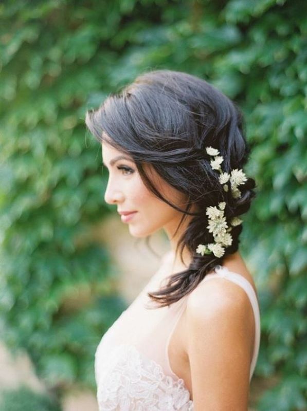 a very elegant retro-inspired low updo with a bump on top is a chic idea for a retro bride