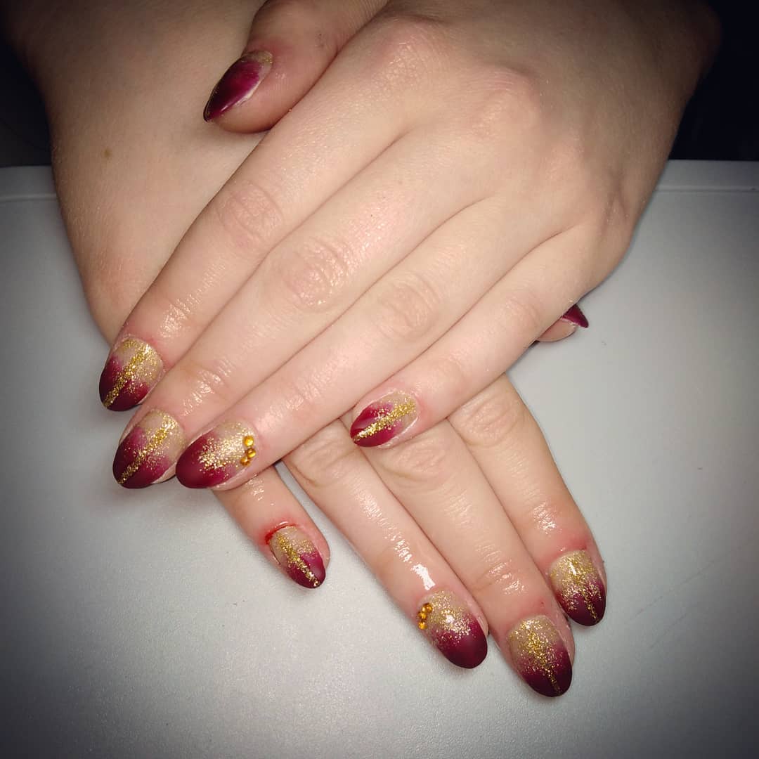 Golden Nails with Red Shimmery Tips