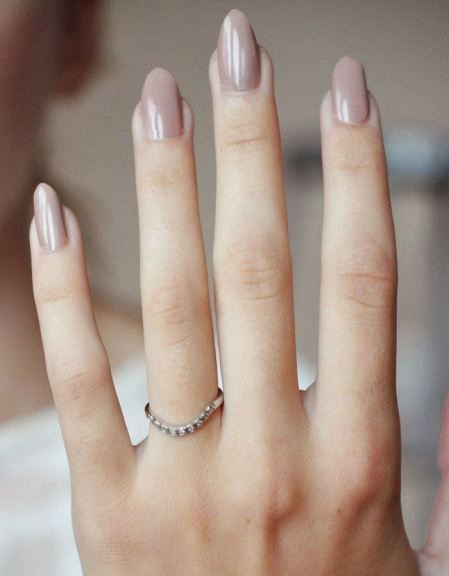 Sophisticated and feminine nude oval nails