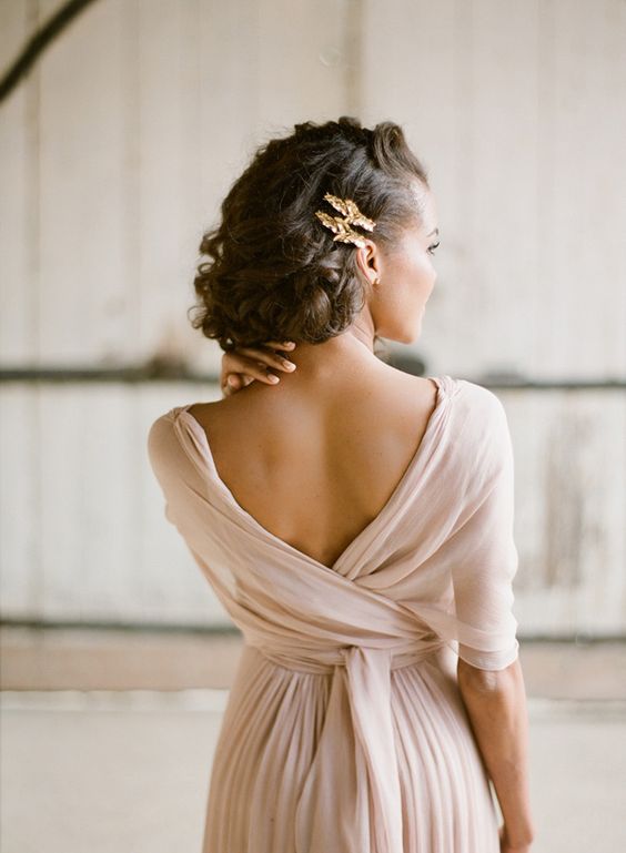 a twisted side updo with airplants because they won't wither